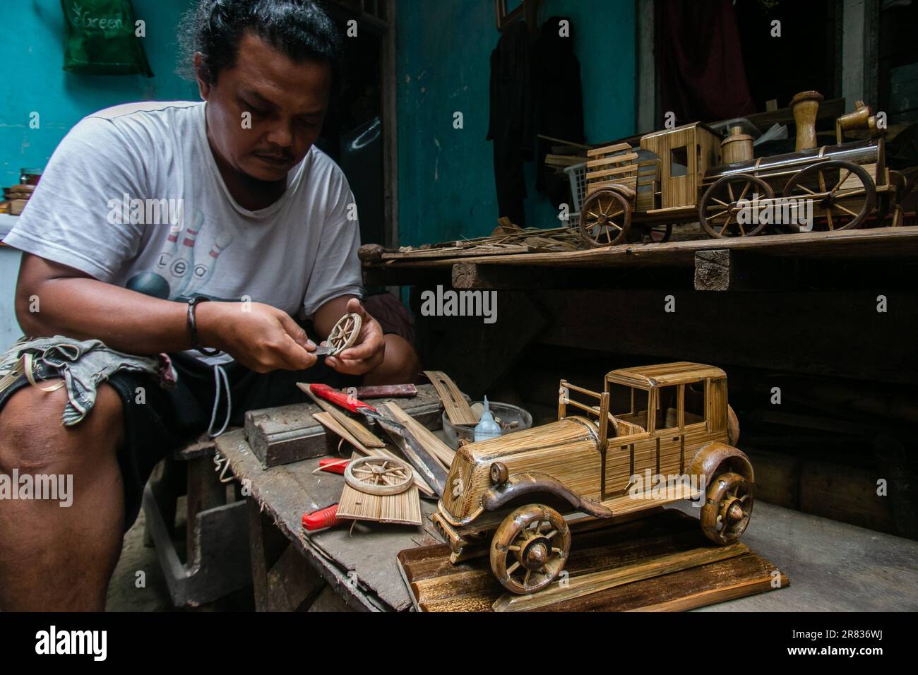 A craftsman makes automotive miniatures from bamboo in Bogor, West Java