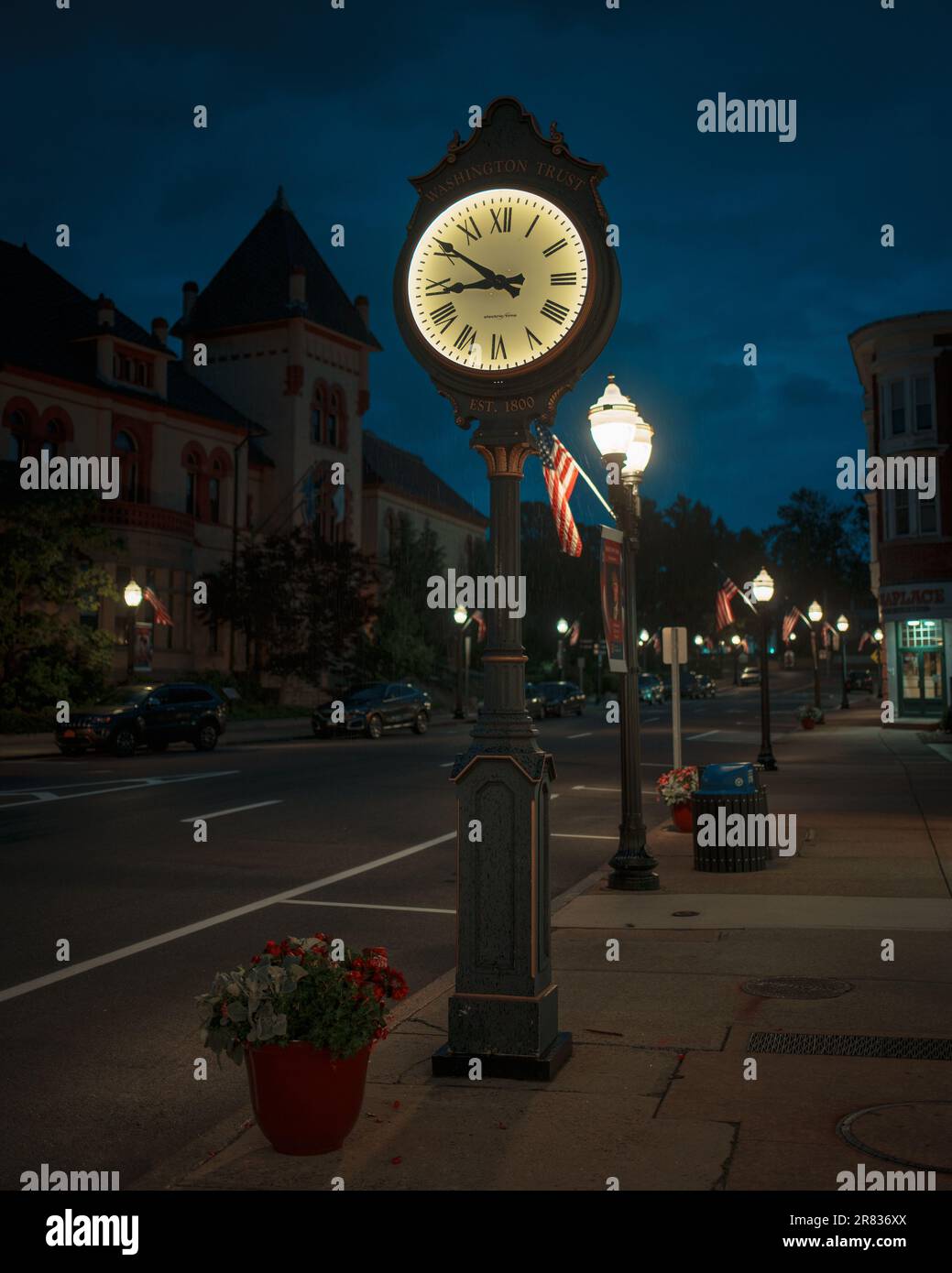 A clock at night in downtown Westerly, Rhode Island Stock Photo
