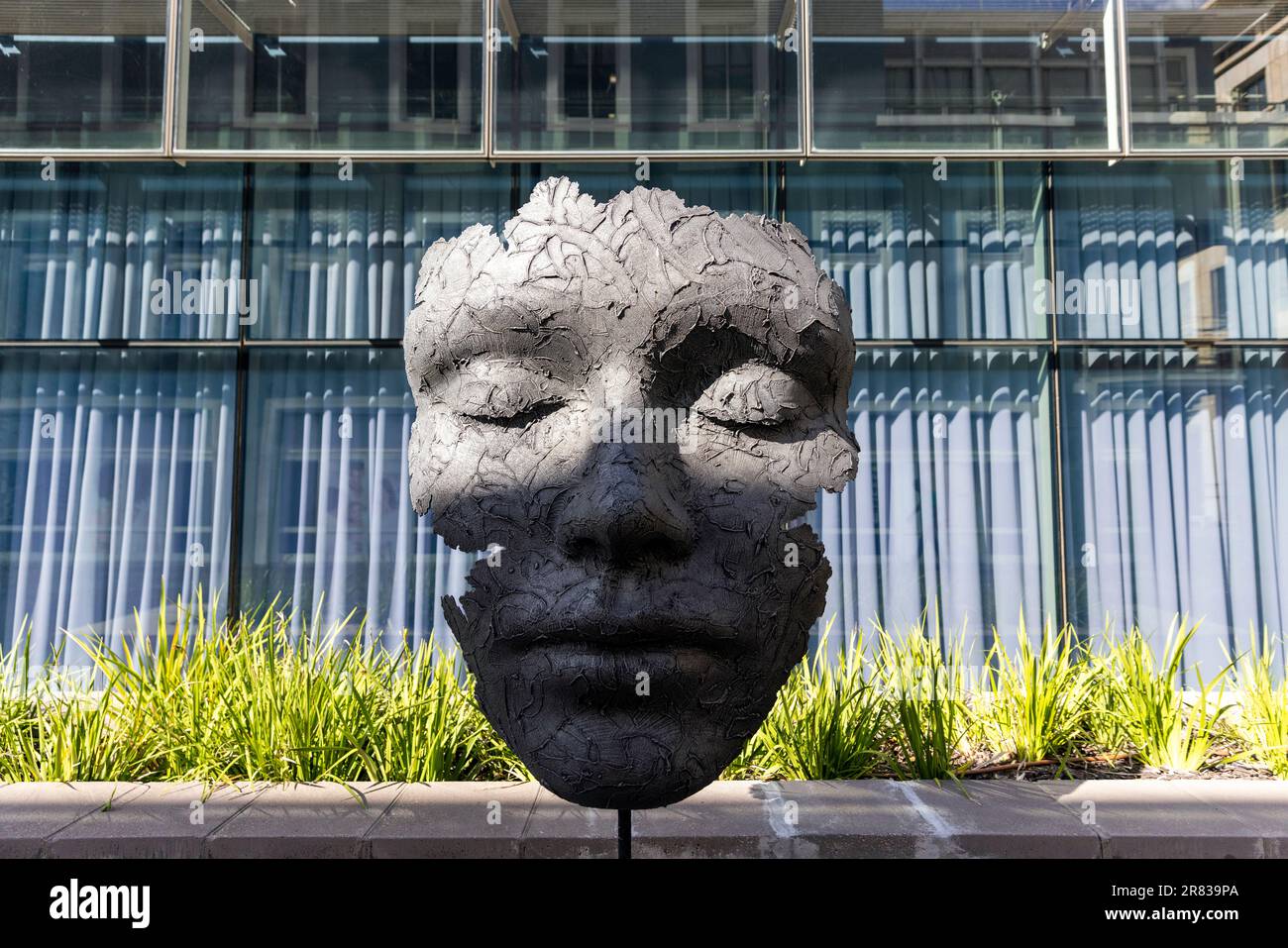 Large bronze face sculpture by artist Marco Olivier in the V&A Waterfront - Cape Town, South Africa Stock Photo