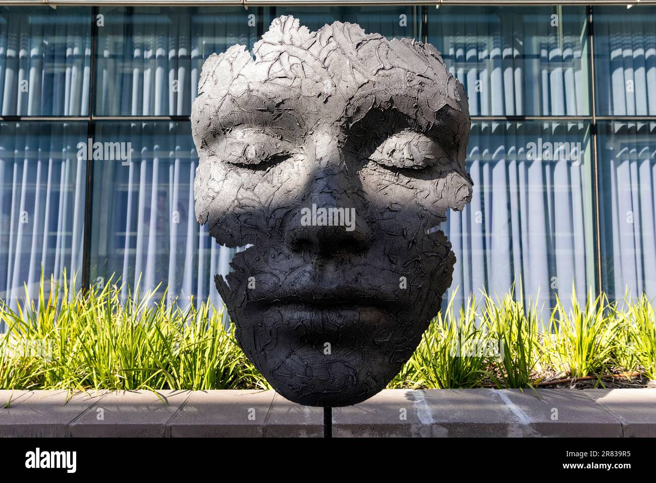 Large bronze face sculpture by artist Marco Olivier in the V&A Waterfront - Cape Town, South Africa Stock Photo