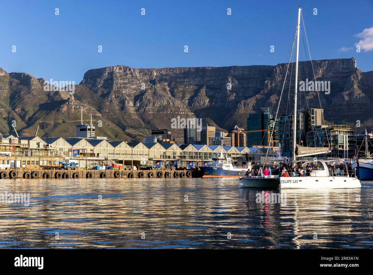 Escape Cat suset cruise in the V&A Waterfront with Table Mountain in the background - Cape Town, South Africa Stock Photo