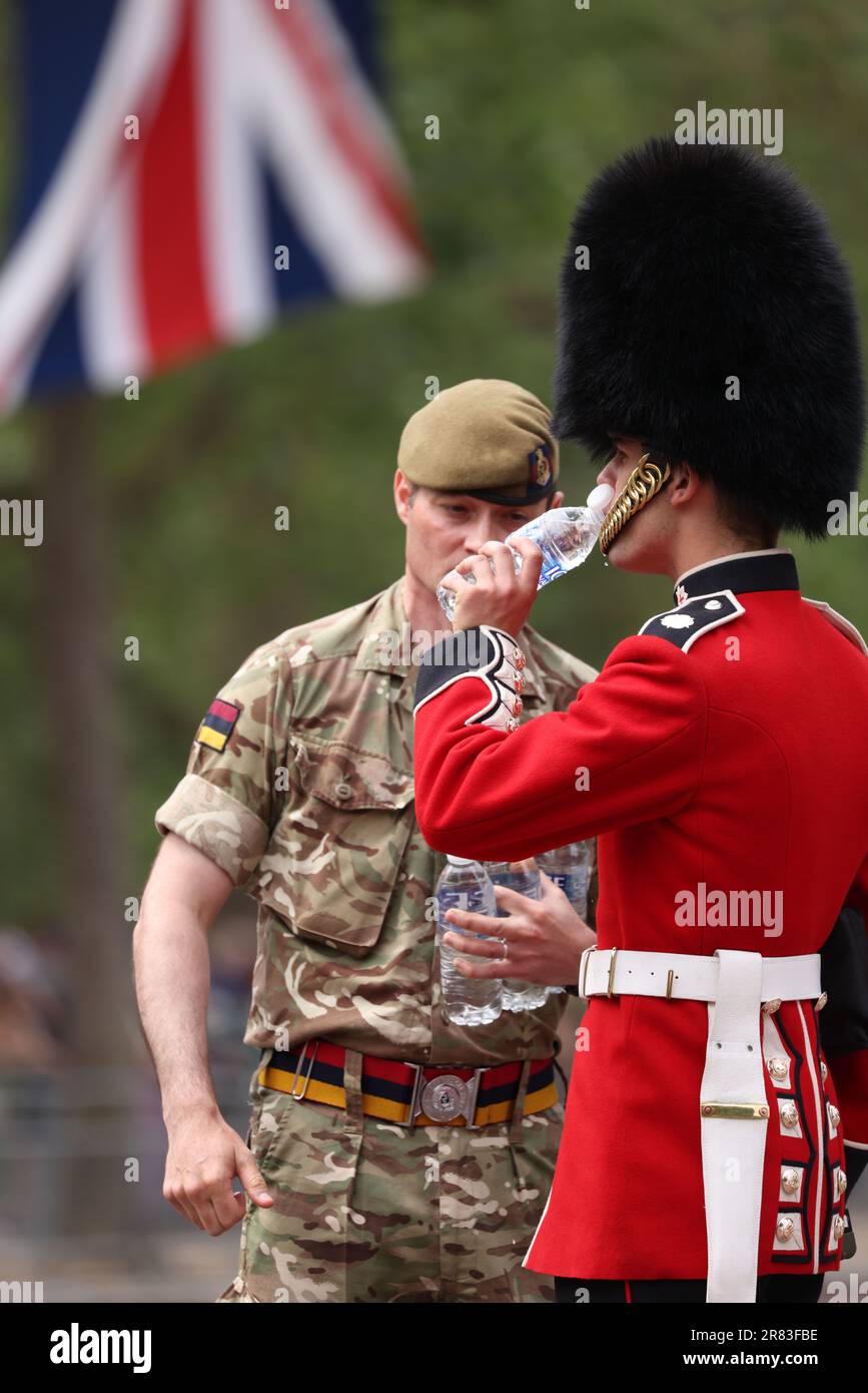 London, UK. 17th June, 2023. A Coldstream Guard is given a refreshing