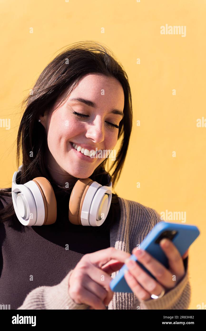 happy young woman using smart phone Stock Photo