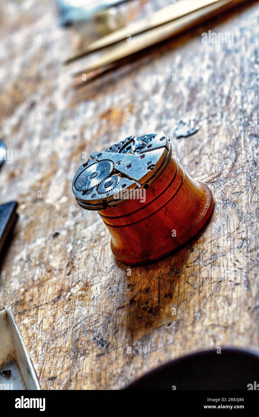 Closeup of wristwatches, pocket watches, gears, springs and mechanisms