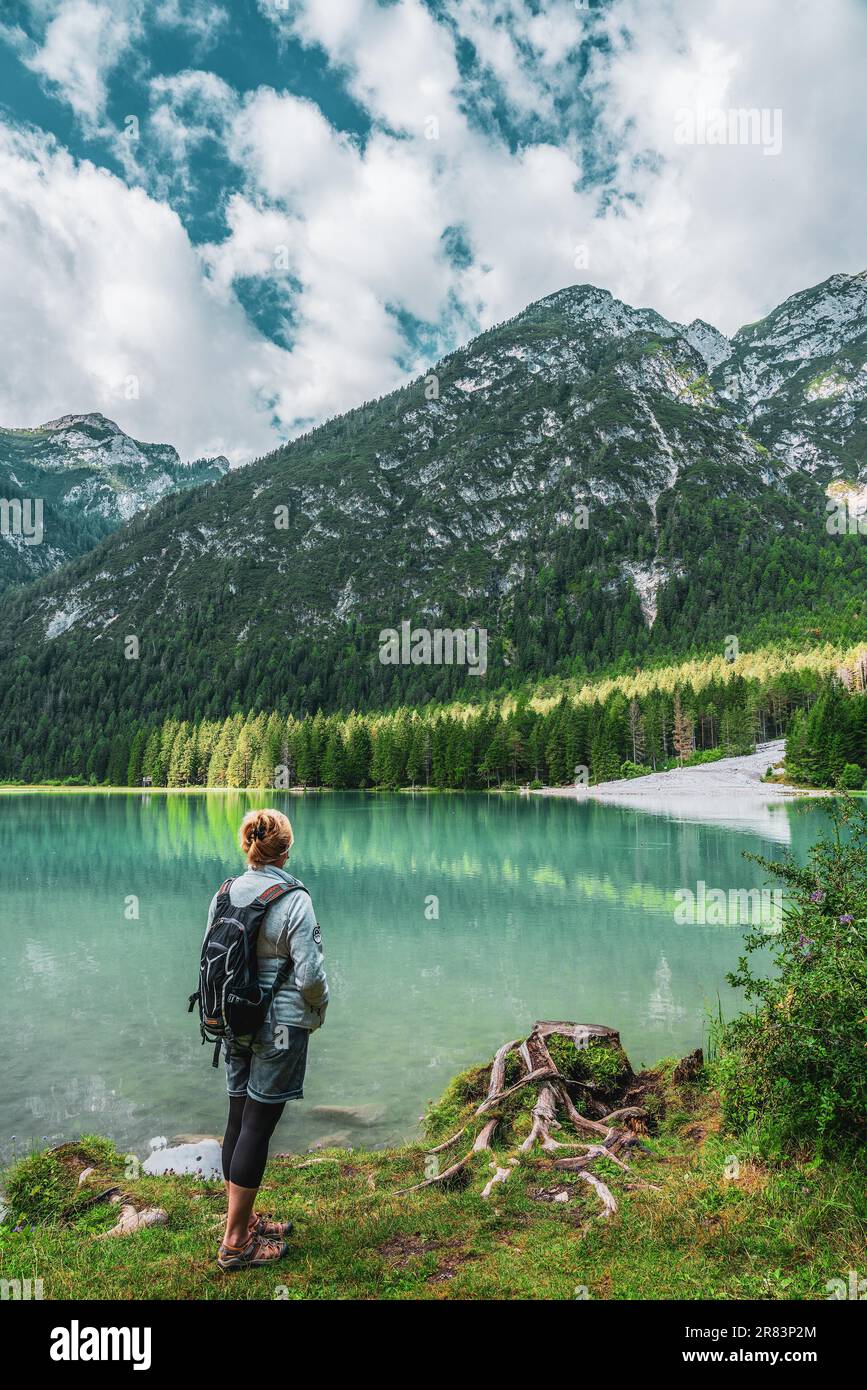 Backpacker on hiking trails in the Dolomites, Italy Stock Photo