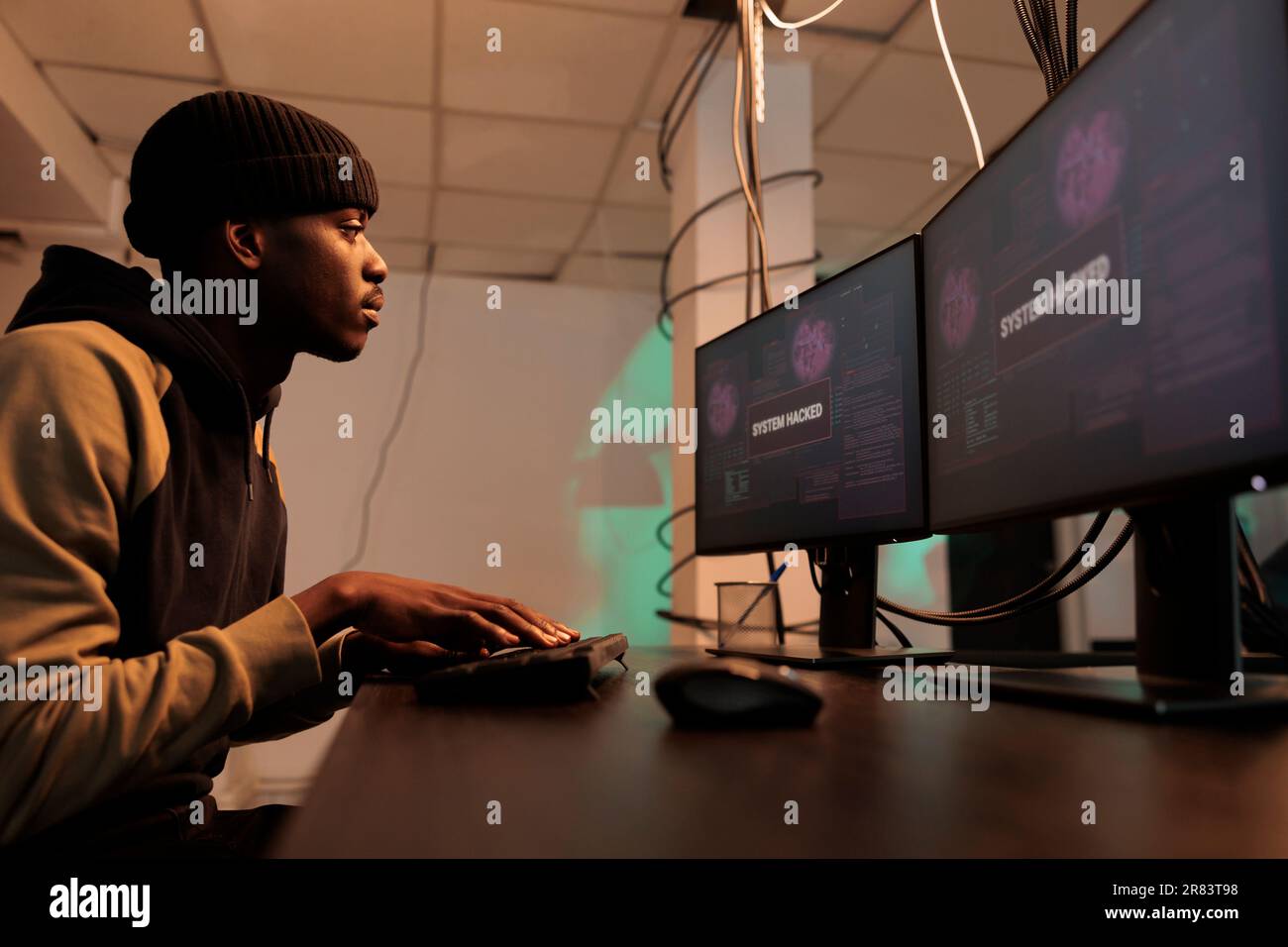 Hacker cyberattack, data breach, man coding password hacking software, breaking into computer internet server. Cybercrime, database information stealing, internet security technology concept Stock Photo
