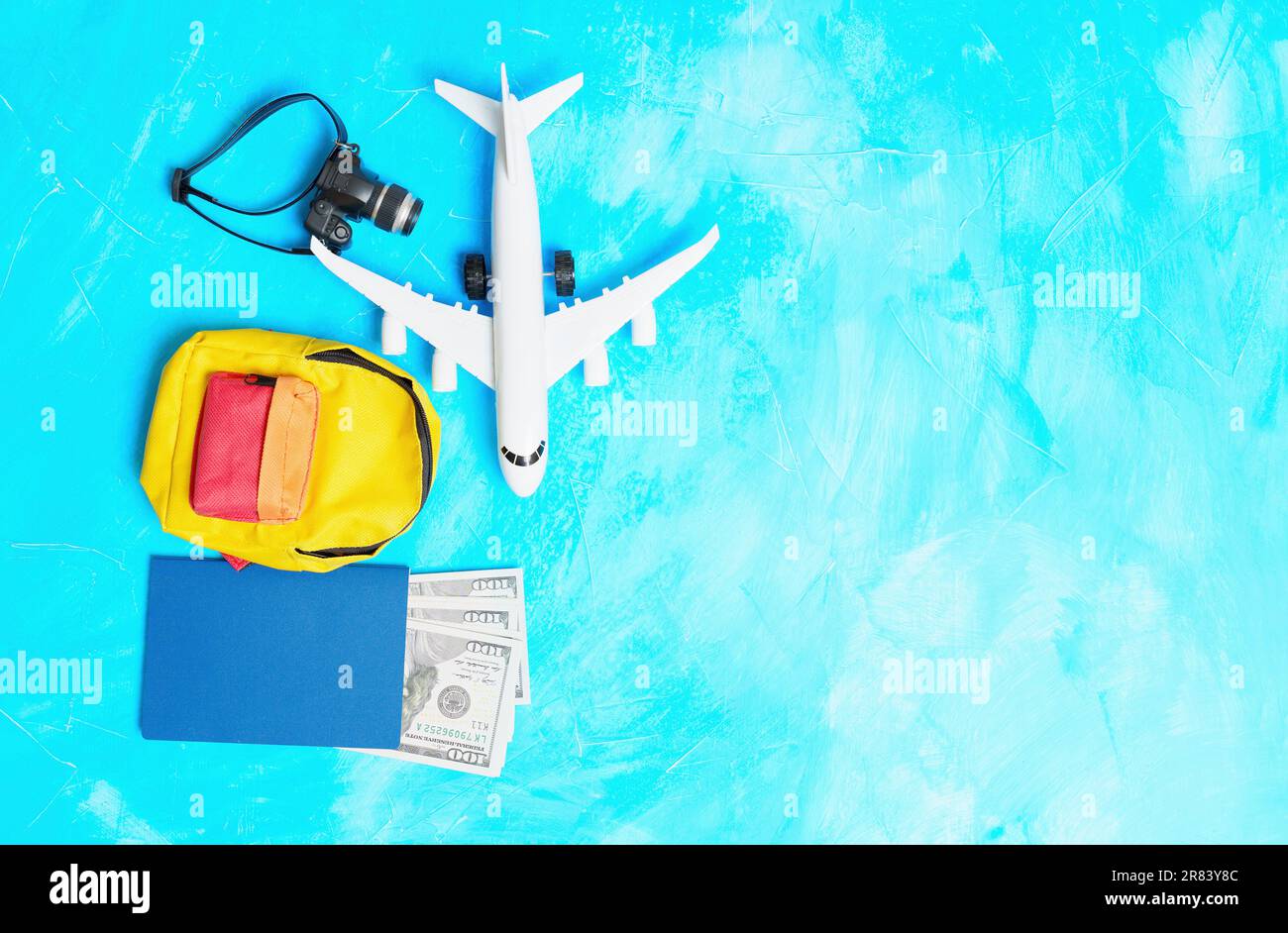 Travel and vacation carryon essentials related background Toy plane
