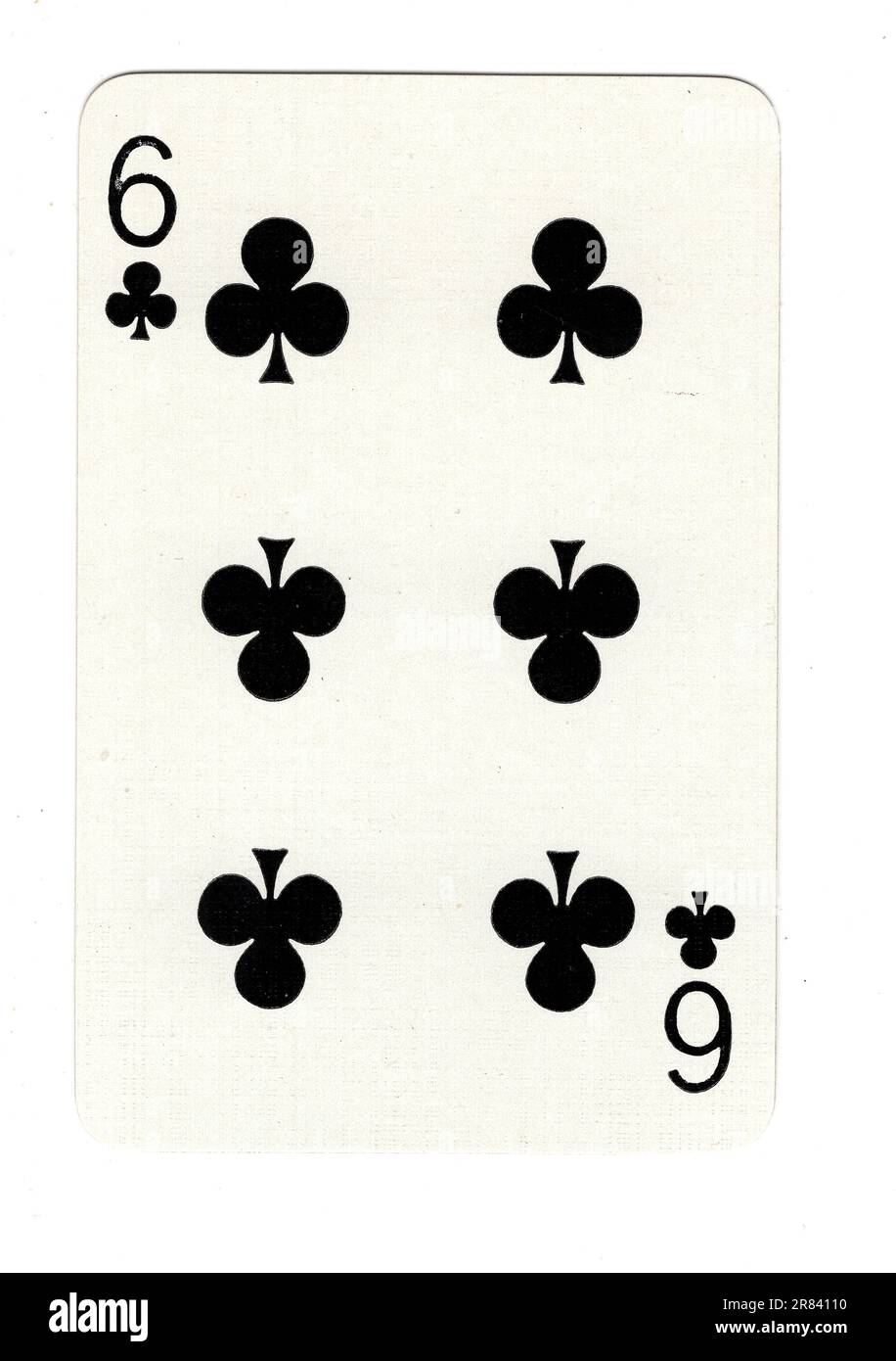 A six of clubs vintage playing card on a white background Stock Photo