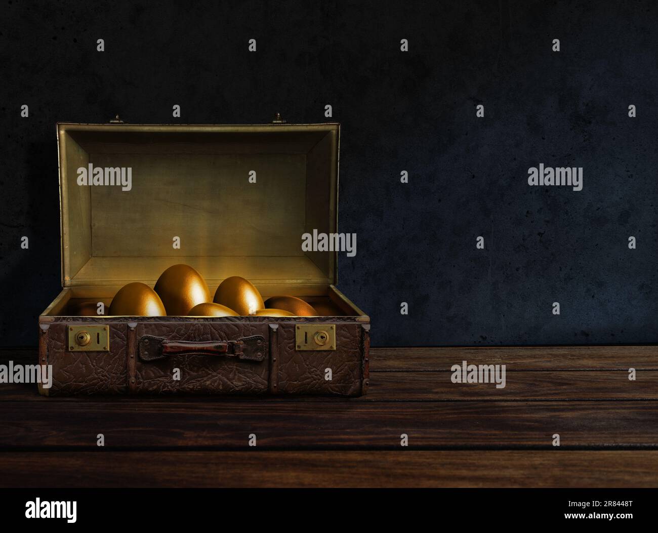 Golden eggs inside an old suitcase Stock Photo