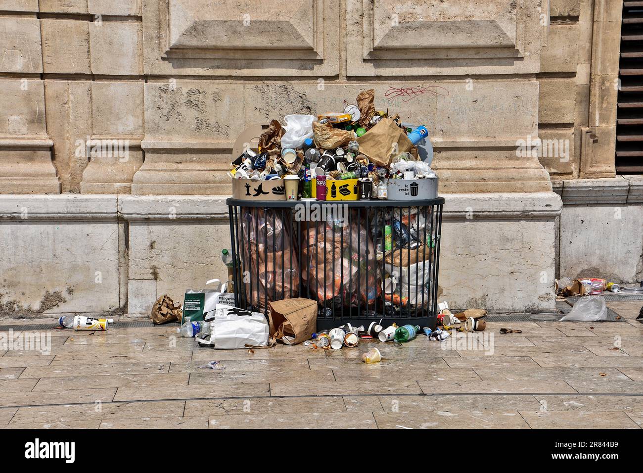 Marseille, France. 18th June, 2023. Waste that overflows from bins to litter the ground is seen at Saint-Charles station during the strike by cleaning agents. On strike since June 12, 2023, cleaning agents no longer collect trash cans in Marseille train station and those in metro stations. Credit: Sipa USA/Alamy Live News Stock Photo