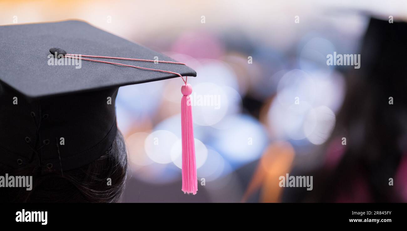 A graduate wearing the cap and gown during the ceremony Stock Photo - Alamy