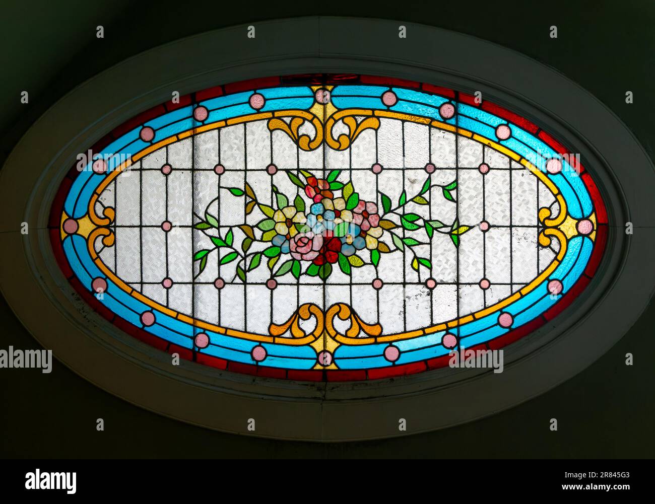 Stained glass oval window inside Casa Molina, Museo de Arte Popular de