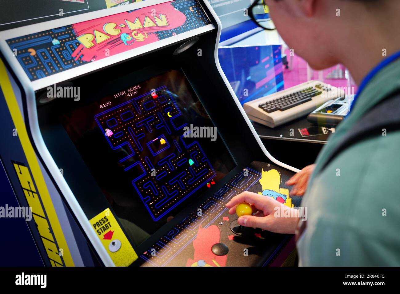 Rimini, Italy - June 15, 2023 :  An game room with the historic Pac-man arcade console Stock Photo