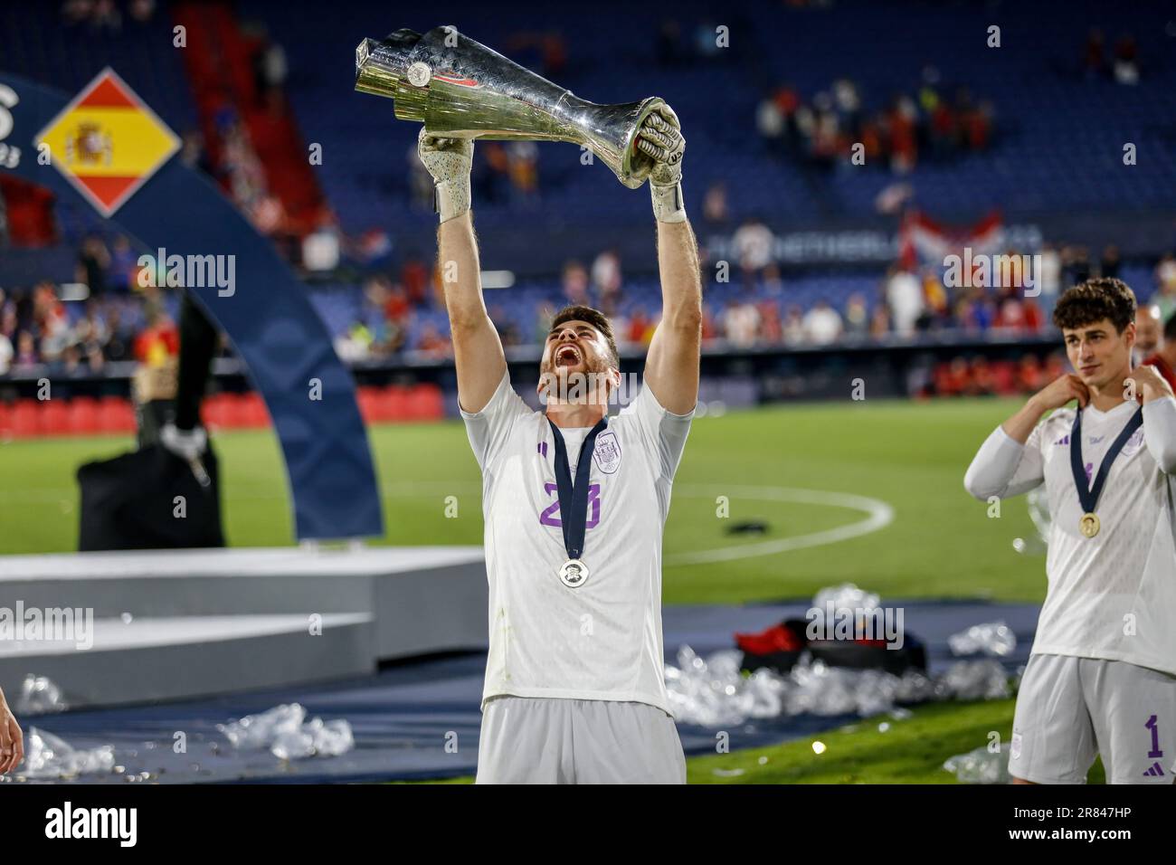 the-player-of-spain-unai-simon-celebrates-with-the-trophy-after-winning