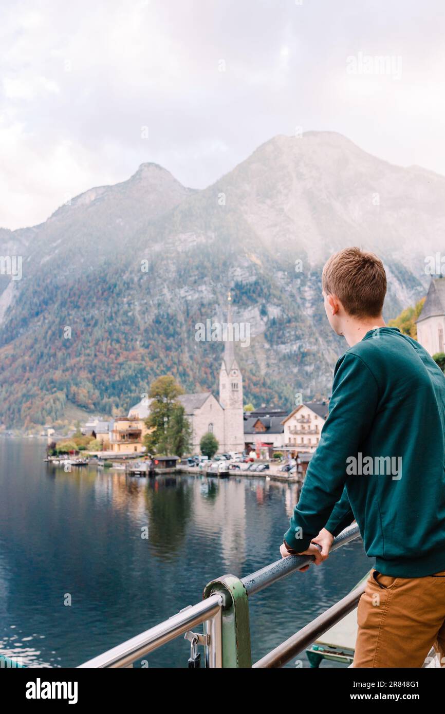 tourist enjoys a view of Lake Hallstatt, Austria Stock Photo
