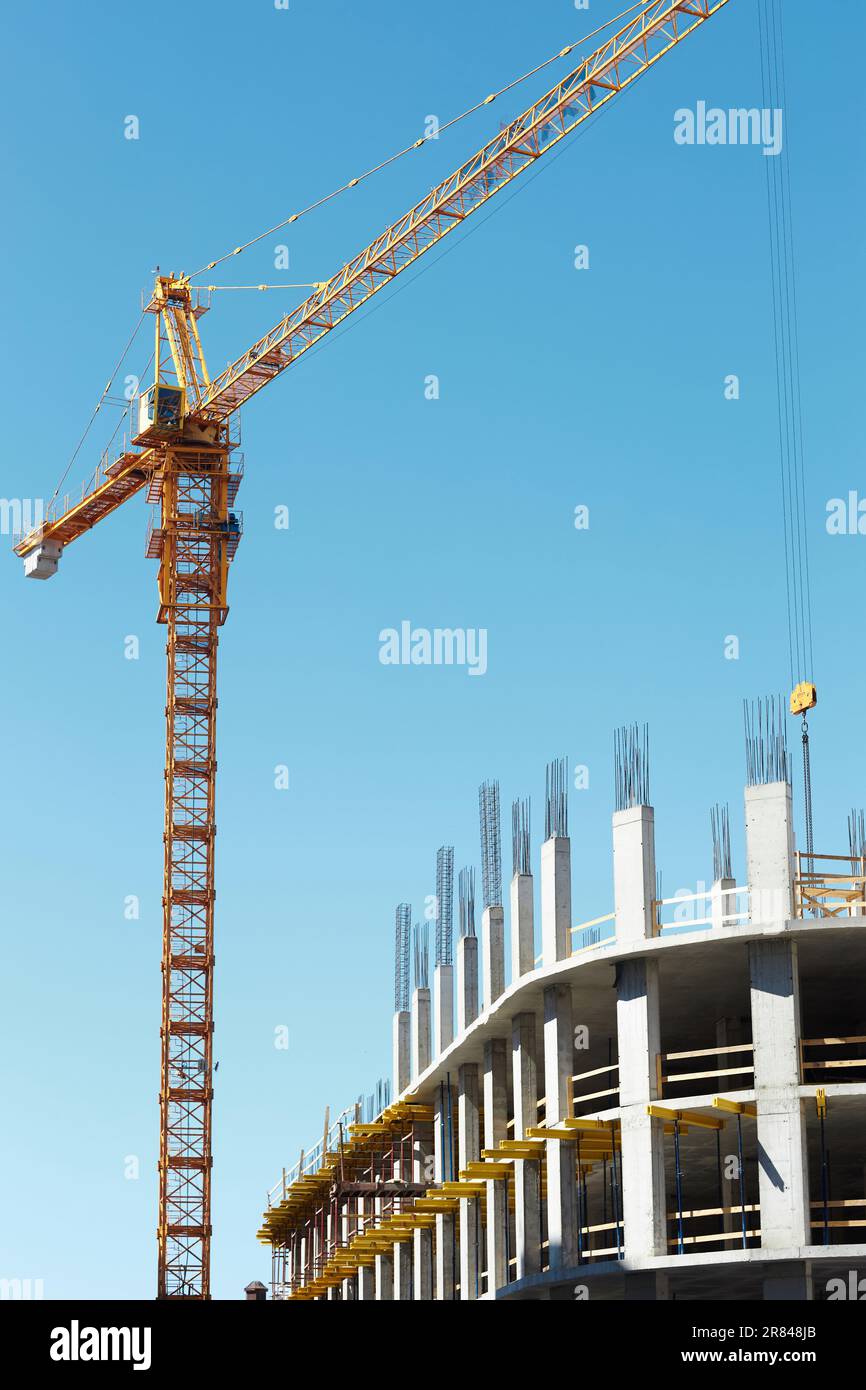 Vertical image of construction crane building tall building in the city ...