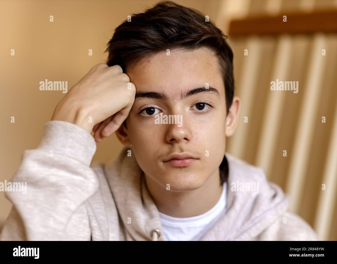 portrait of pensive teenage boy Stock Photo