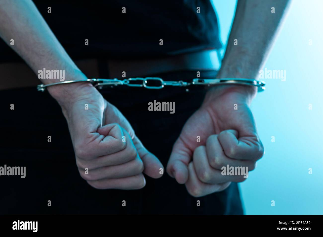 prisoner concept, Handcuffed hands of a prisoner in prison, Male