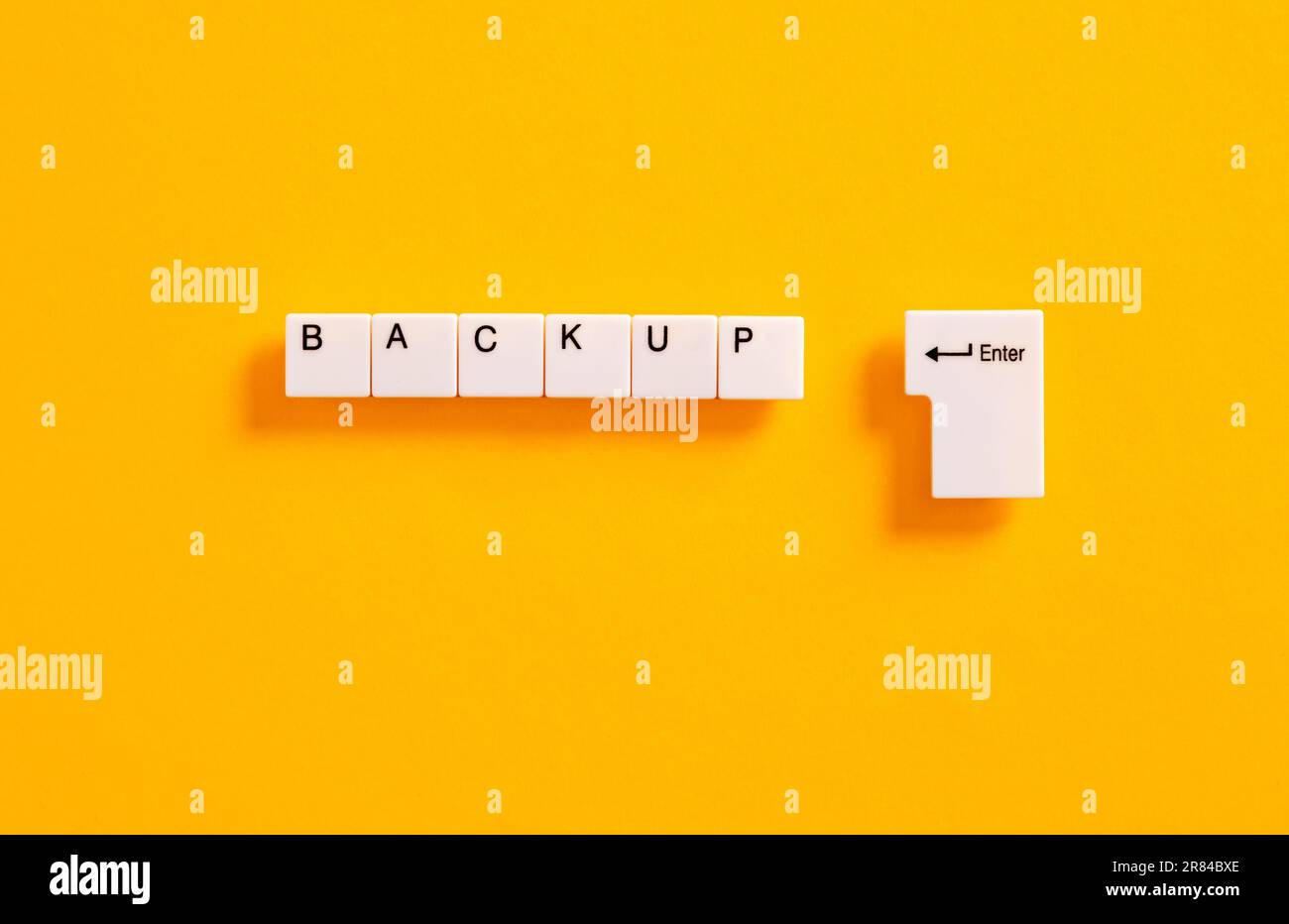 Computer file and data online backup or business backup plan concept. Computer keyboard keys with the word backup. Stock Photo