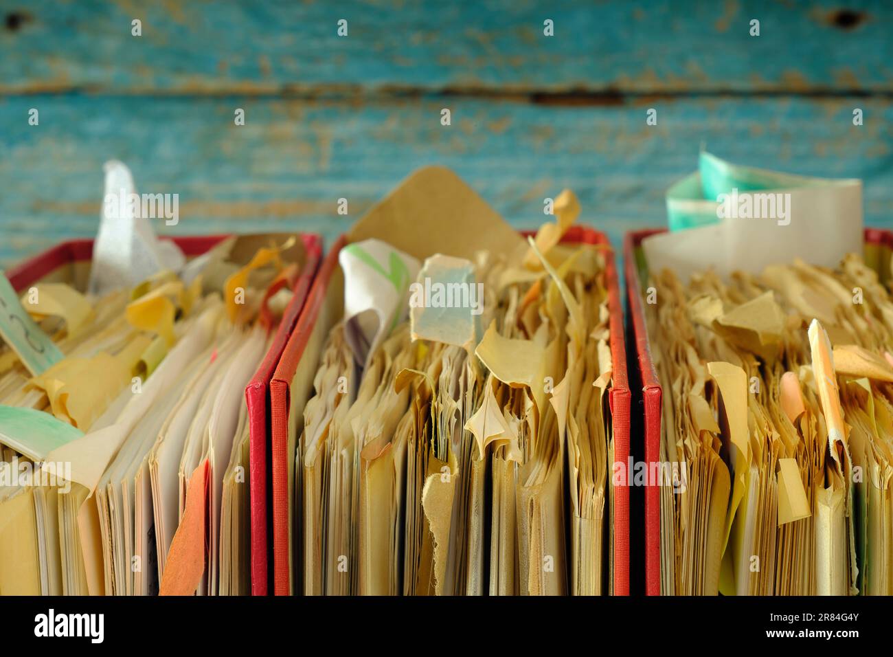 messy file folders,red tape, bureaucracy,aministration,business concept.Close up,narrow depth of field,free copy space. Stock Photo