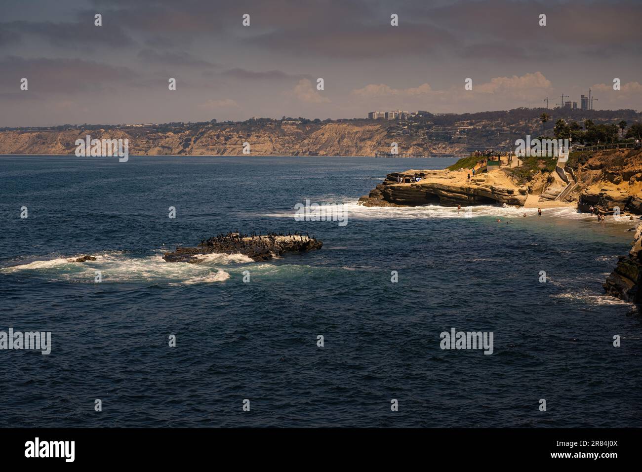 An aerial view of sea waves breaking rocky beach Stock Photo - Alamy
