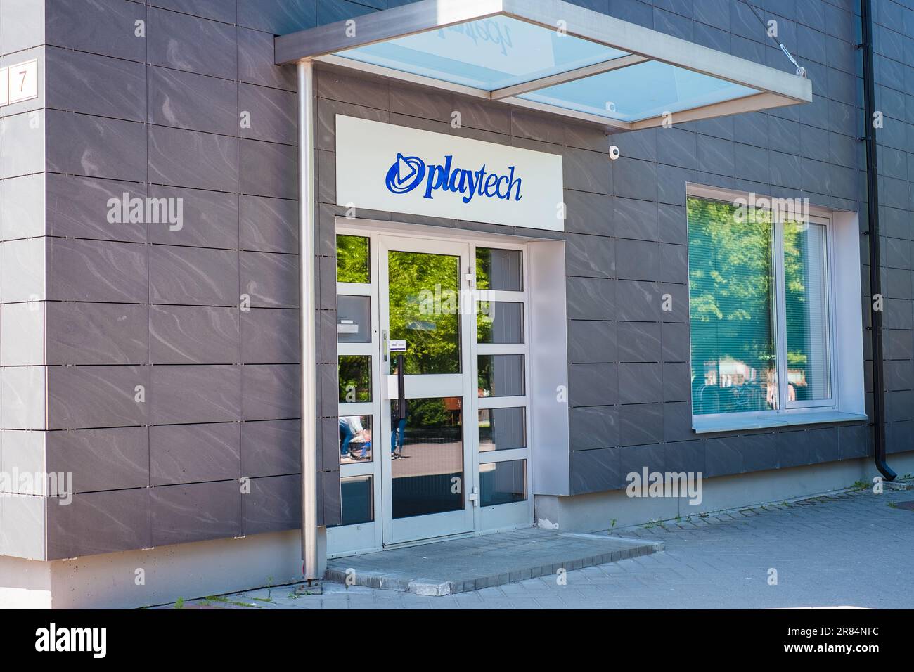Tartu, Estonia - June 10, 2023: Playtech sign on their main building. Playtech Group development center in Estonia. Stock Photo