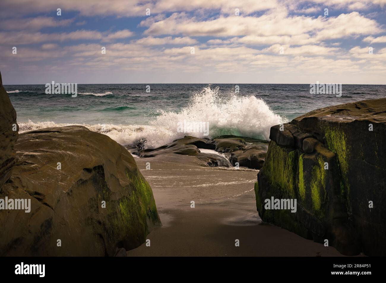 A view of sea waves breaking rocky beach Stock Photo - Alamy
