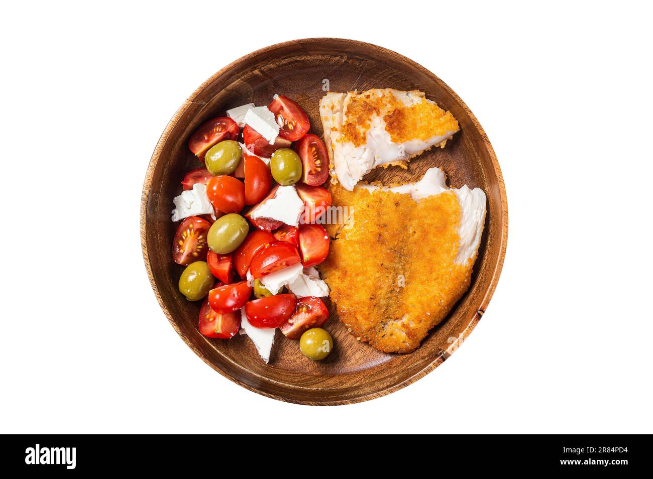 Fried tilapia fillet on a plate with salad. Isolated on white