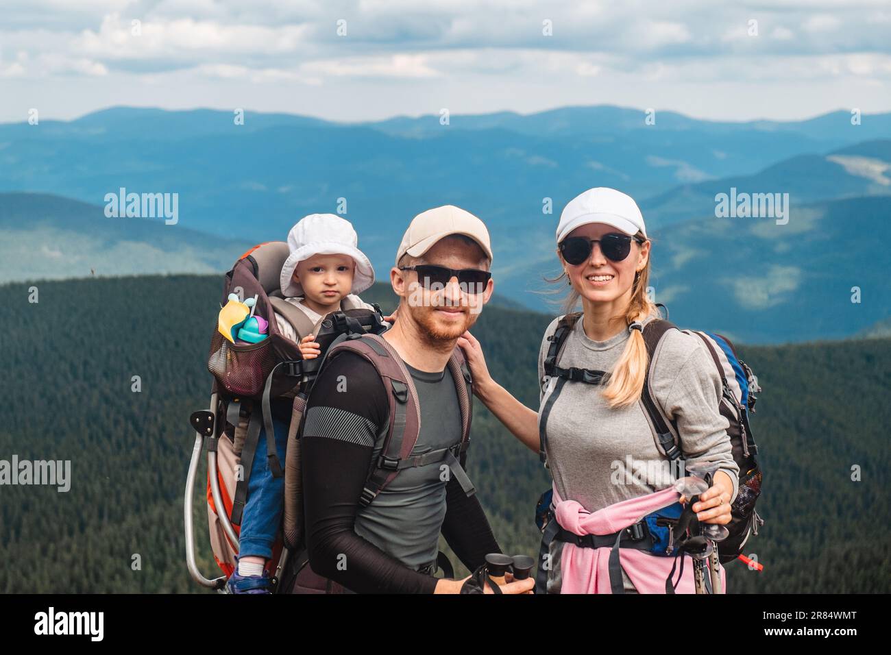 A family with a baby in the mountains Stock Photo - Alamy