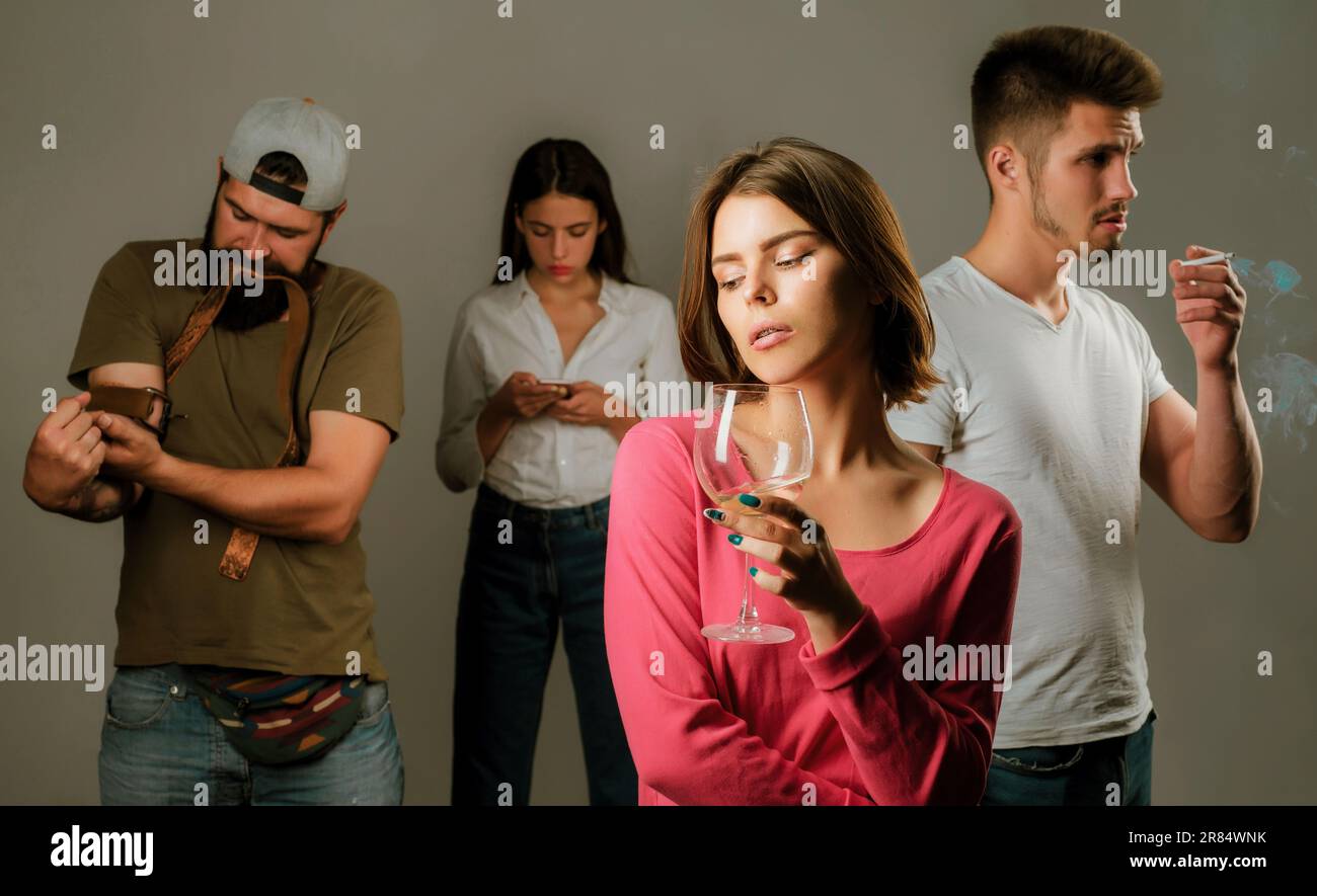 Stop alcohol addiction. Addictive group including alcohol cigarettes and drugs. Hard drugs and alcohol addict. Serious sad woman having alcohol Stock Photo