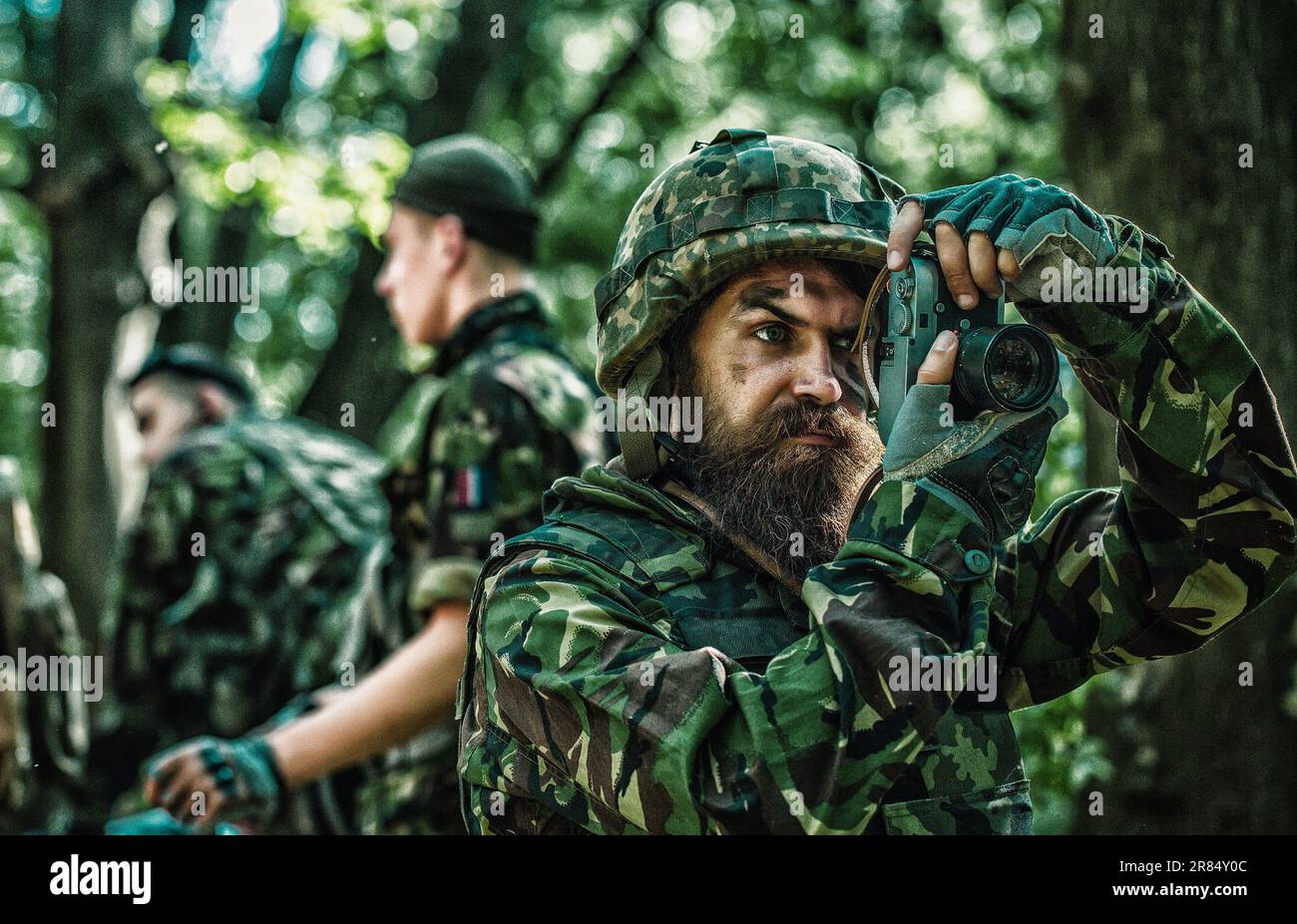 Photojournalist documenting war, military press photographer. Military