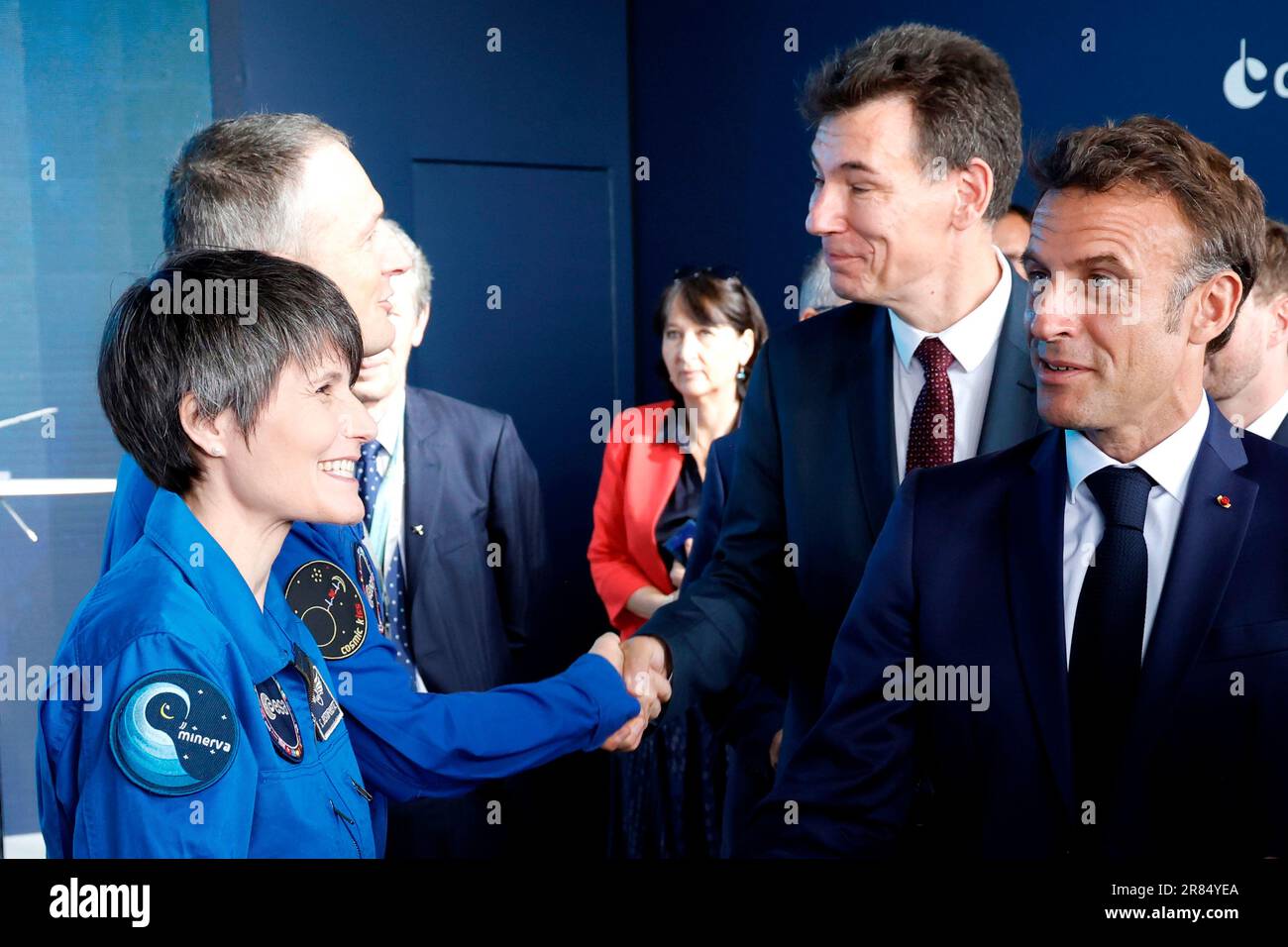 Italian astronaut Samantha Cristoforetti, left, watches French President Emmanuel Macron at the International Paris Air Show at the Paris Le Bourget airport, north of Paris, Monday, June 19, 2023. Aviation industry CEOs and top government officials from around the world descended on the Paris Air Show on Monday for a week of deal-making and demonstrations of the world's latest air and space technology. (Ludovic Marin, Pool via AP) Stock Photo