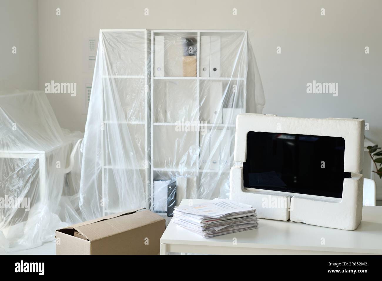 Horizontal image of packing furniture and documents for the move in new