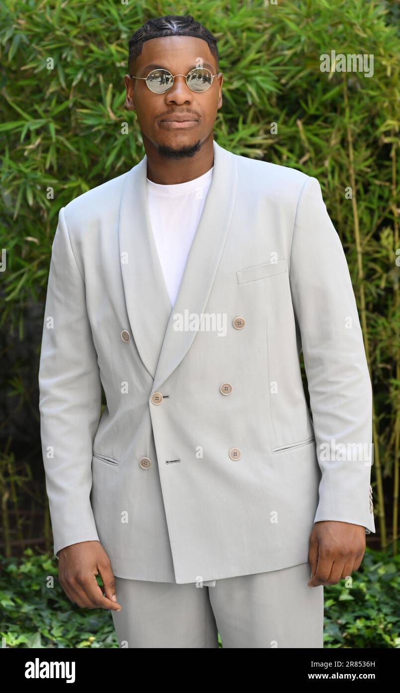 Milan, Italy. June 19, 2023, Milan, Italy: Briths actor John Boyega poses  for photographers upon his arrival to attend the Giorgio Armani Men's  Fall/Winter 2023-24 presentation during the Milan Fashion Week, in