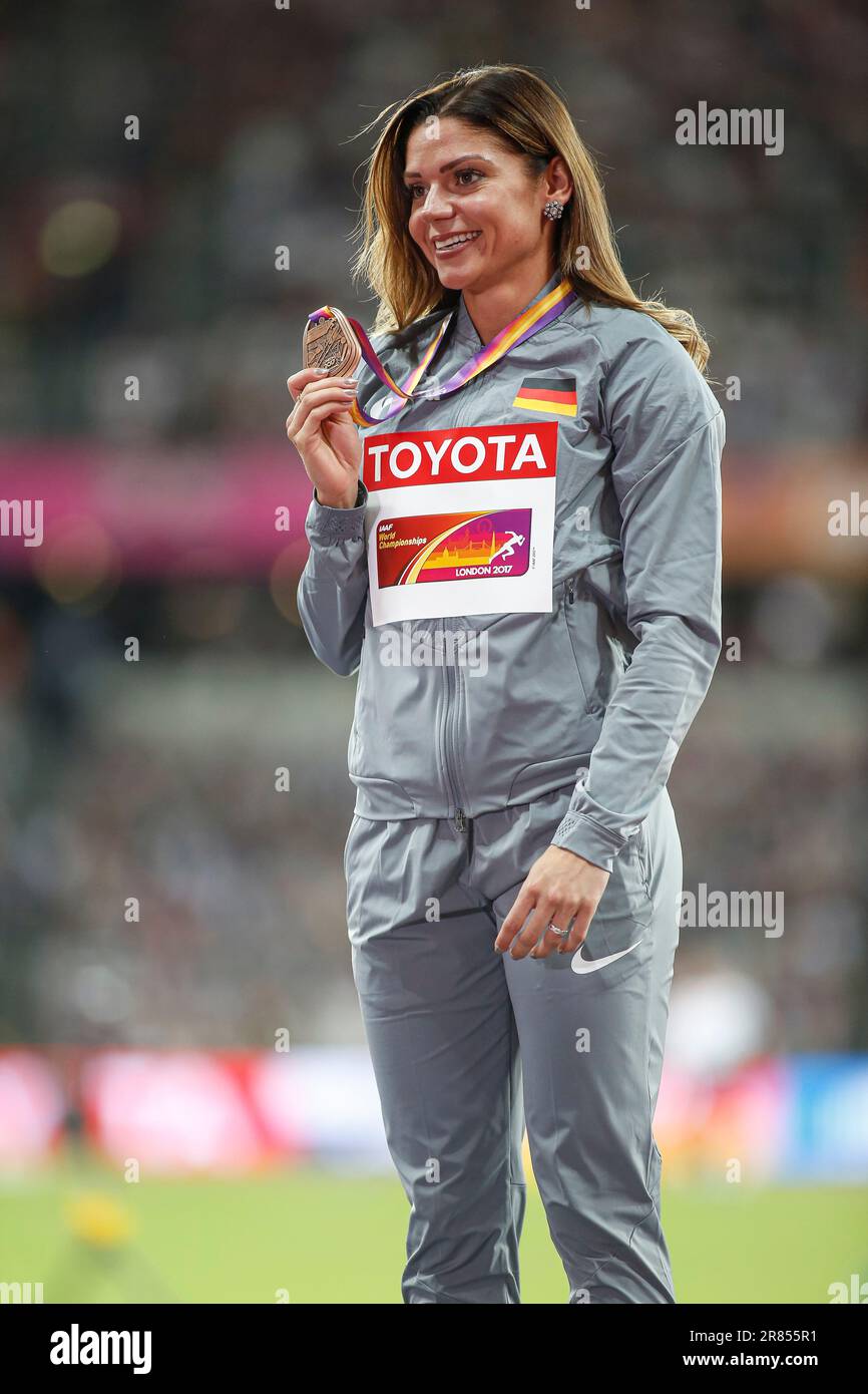 Pamela Dutkiewicz at the award ceremony and receiving the medal at the