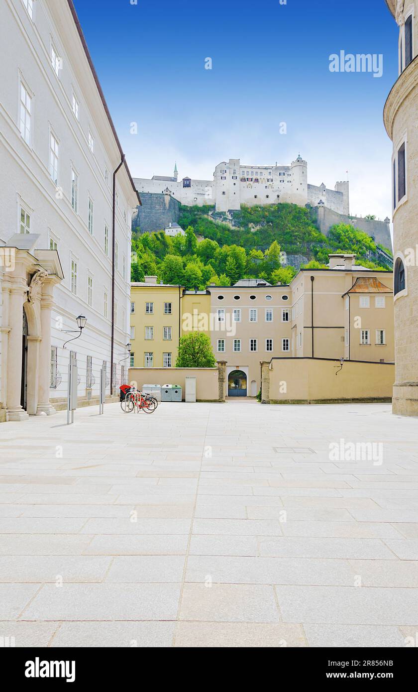 Hohensalzburg Fortress in Salzburg city in Austria, as seen from the Residence Square (Residenzplatz), in the old town and historic centre. Stock Photo