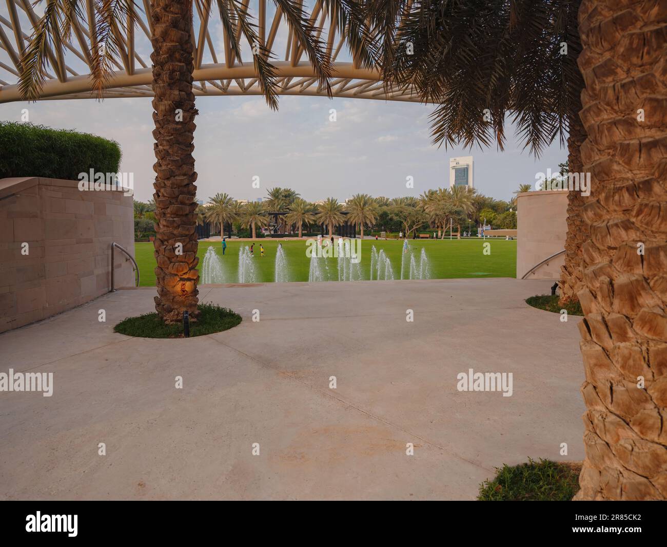 Large green evening park in the big city Umm Al Emarat Park in Abu