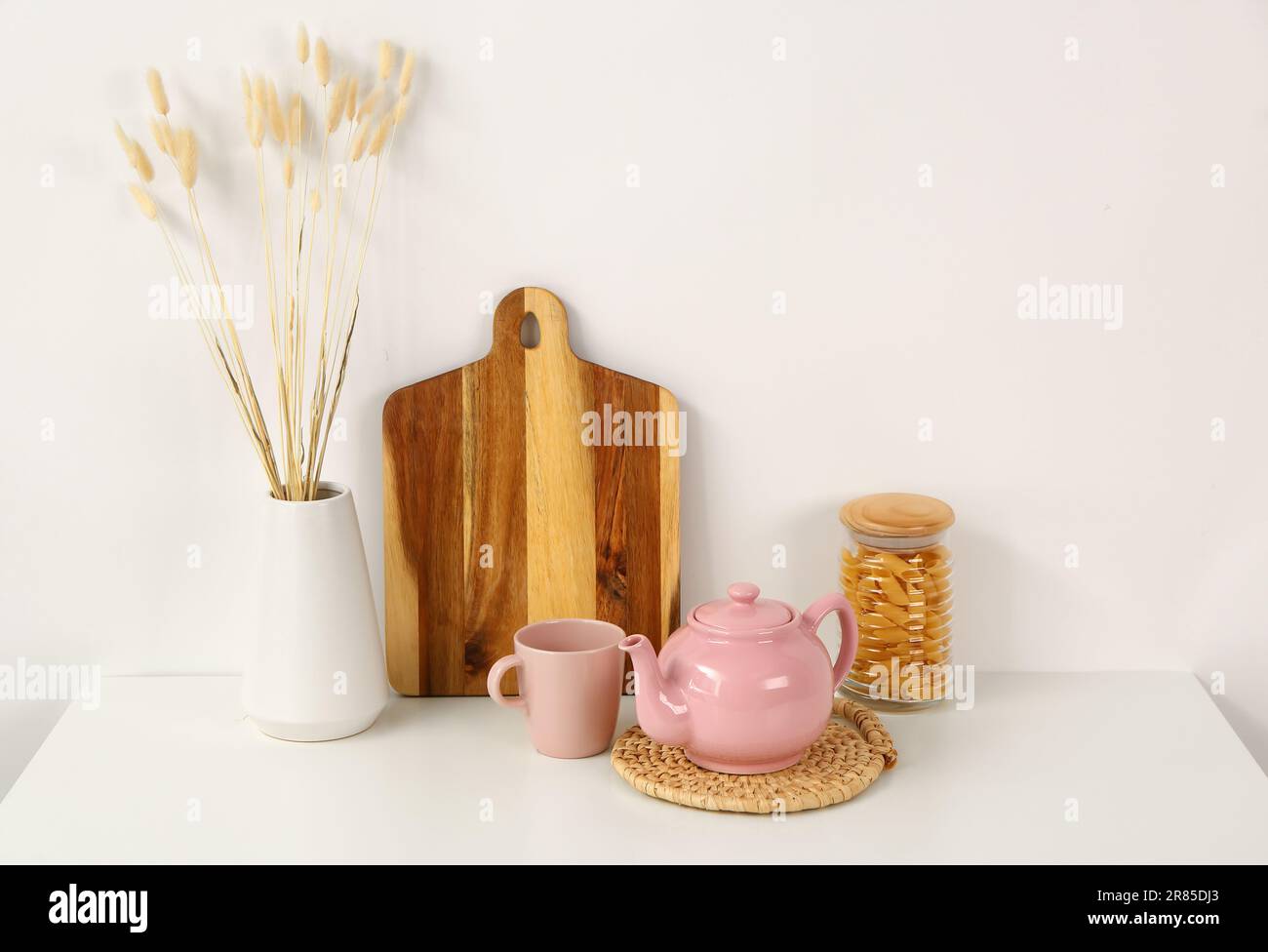 Composition with beautiful tea set and different items on white table ...
