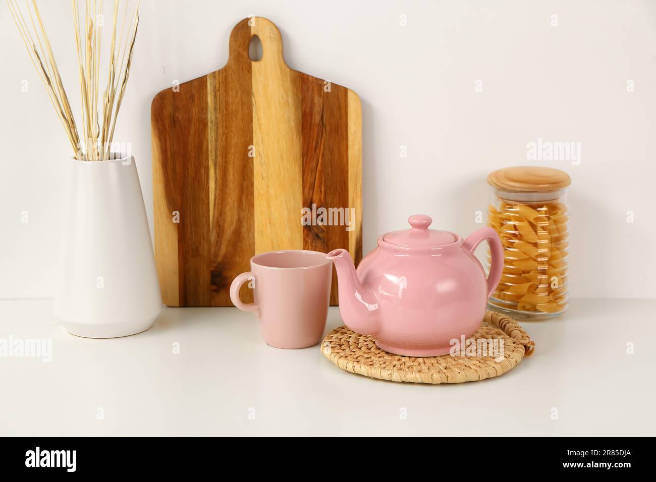 Composition with beautiful tea set and different items on white table ...