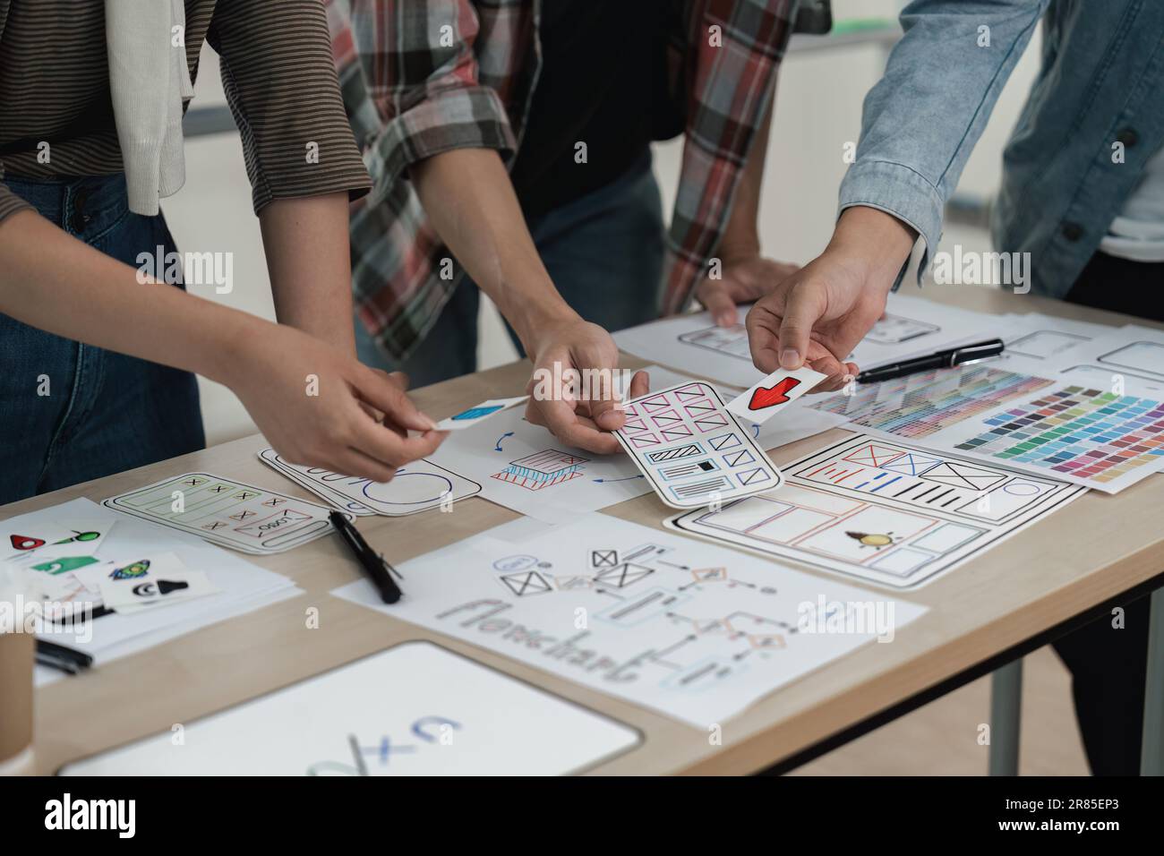 UX developer and UI designer brainstorming about app interface ...