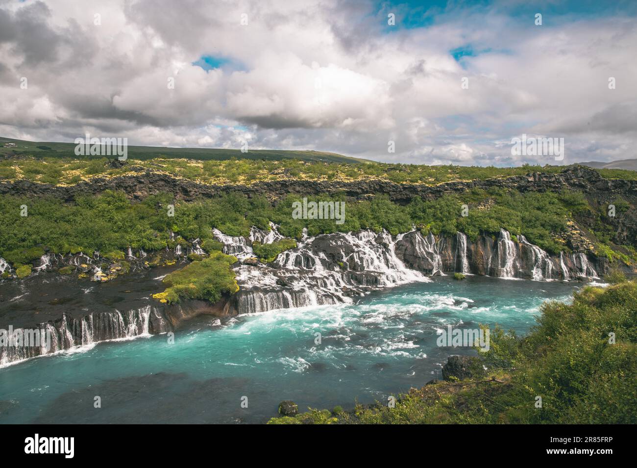 Icelandic amazing Hraunfossar Waterfalls and lazure blue water Stock