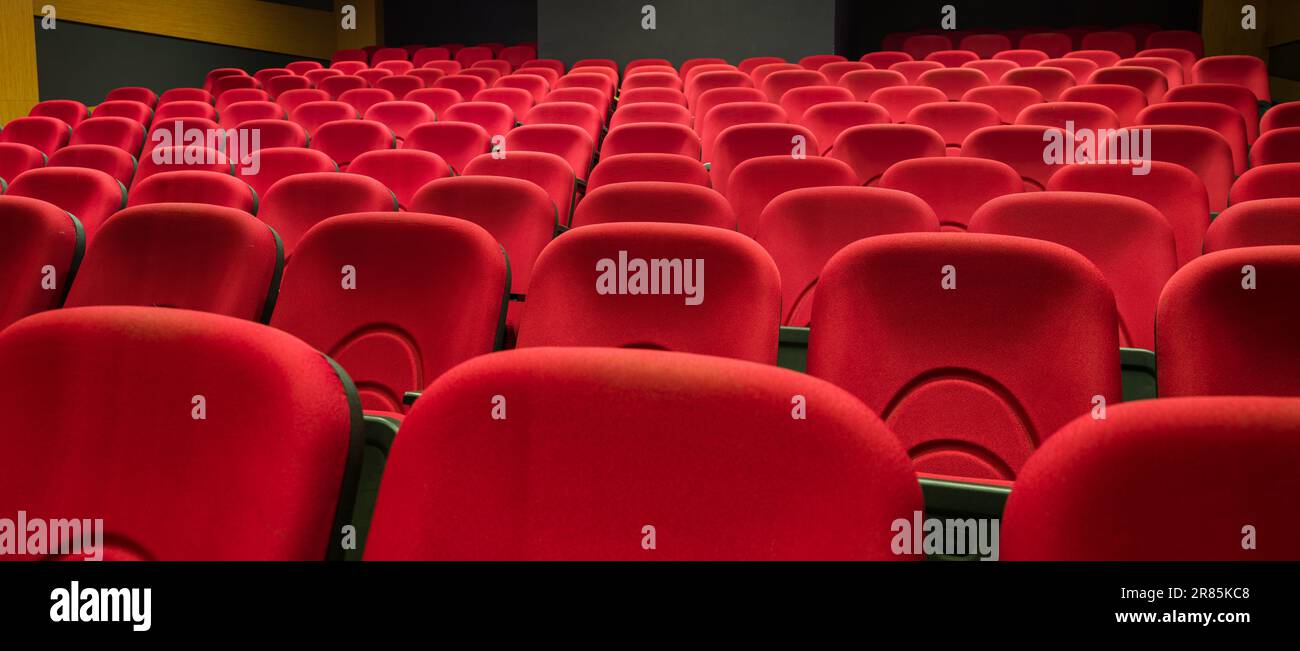 Red auditorium chairs. Empty movie theater seats Stock Photo Alamy