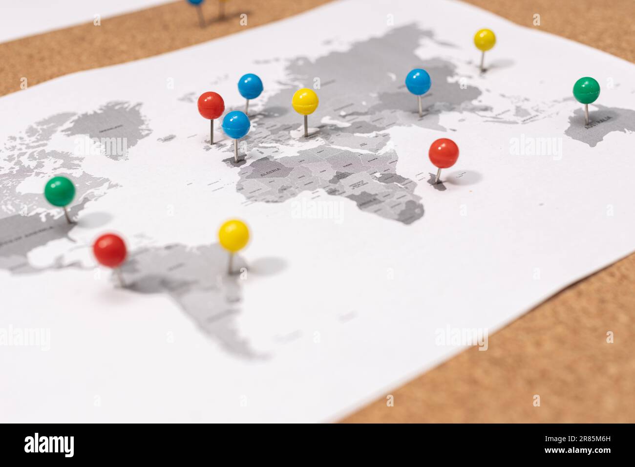 Close up of ball pins on world map on Corkboard. Travel destination concept Stock Photo