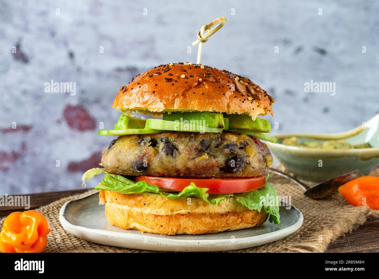 Plantain and black bean burger in brioche bun Stock Photo Alamy