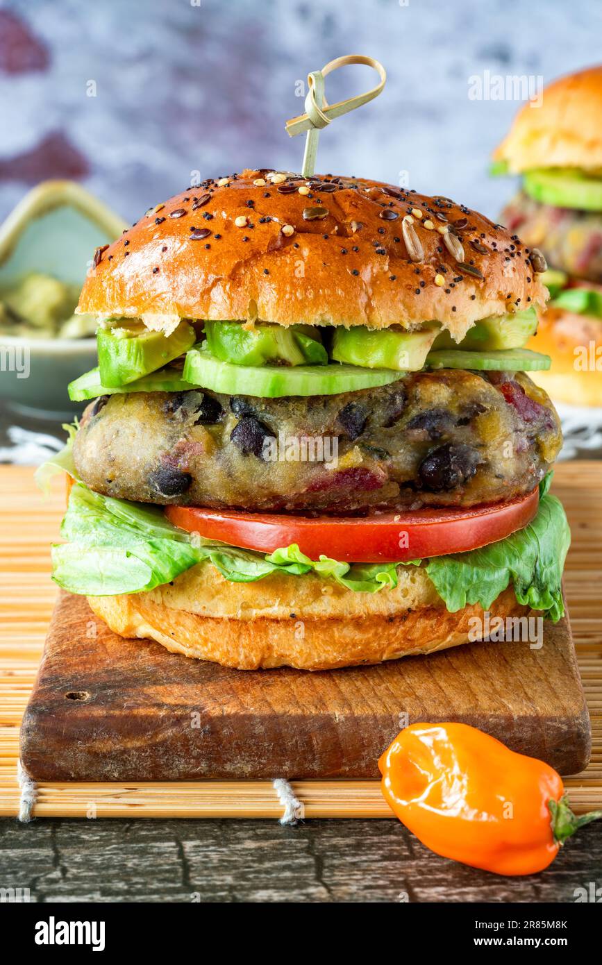 Plantain and black bean burger in brioche bun Stock Photo Alamy