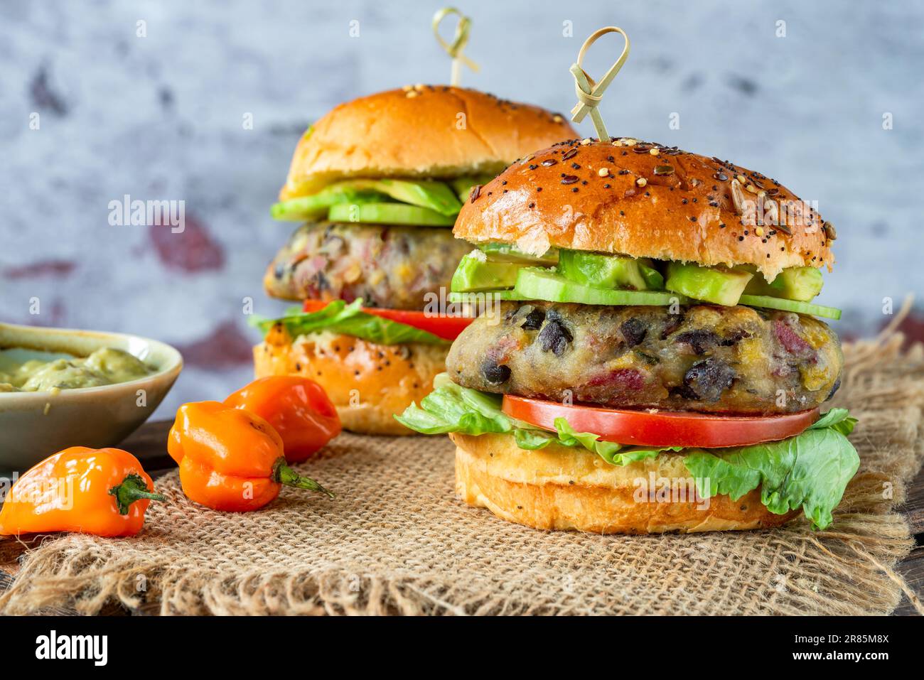 Plantain and black bean burger in brioche bun Stock Photo Alamy