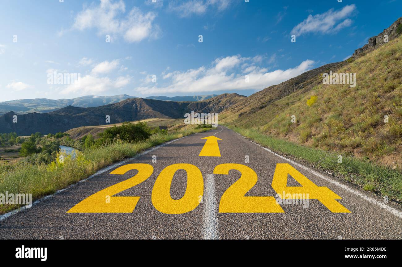 New year goals. The numbers for 2024 were written on the rural road. Beginning of the new year 2024 Stock Photo