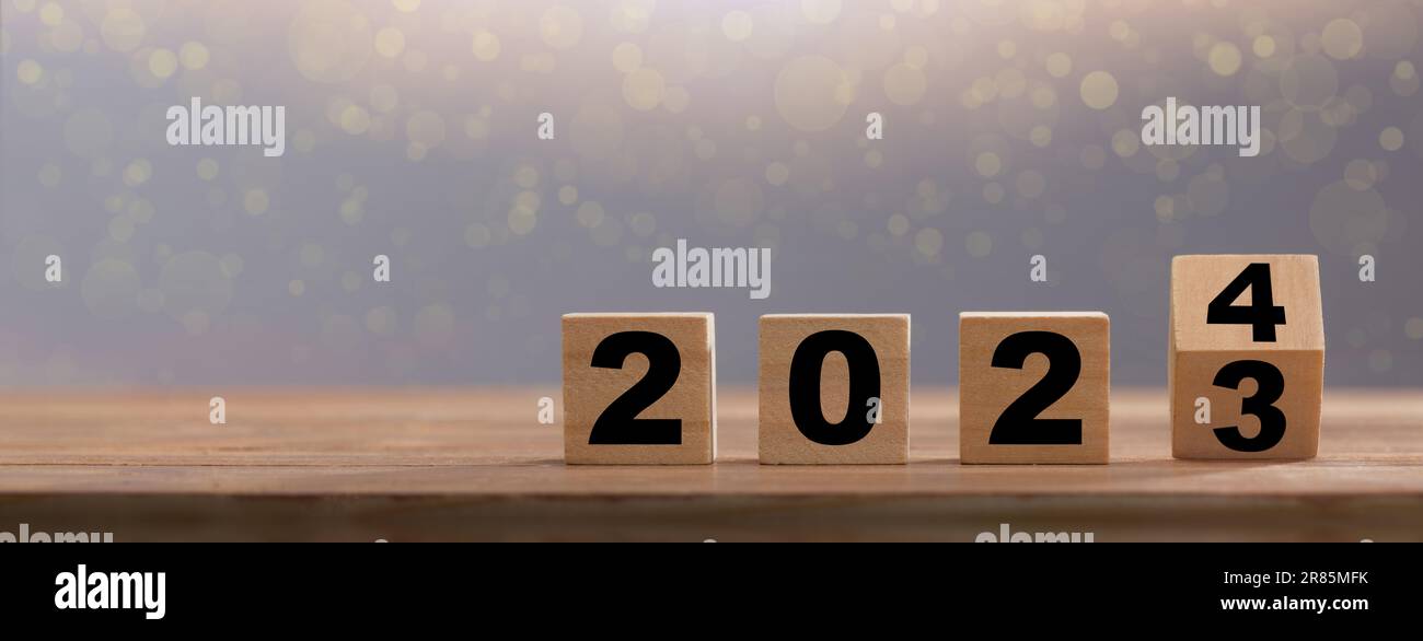 Happy new year 2024. Wooden calendar cubes change from 2023 to 2024. New year background with copy space Stock Photo