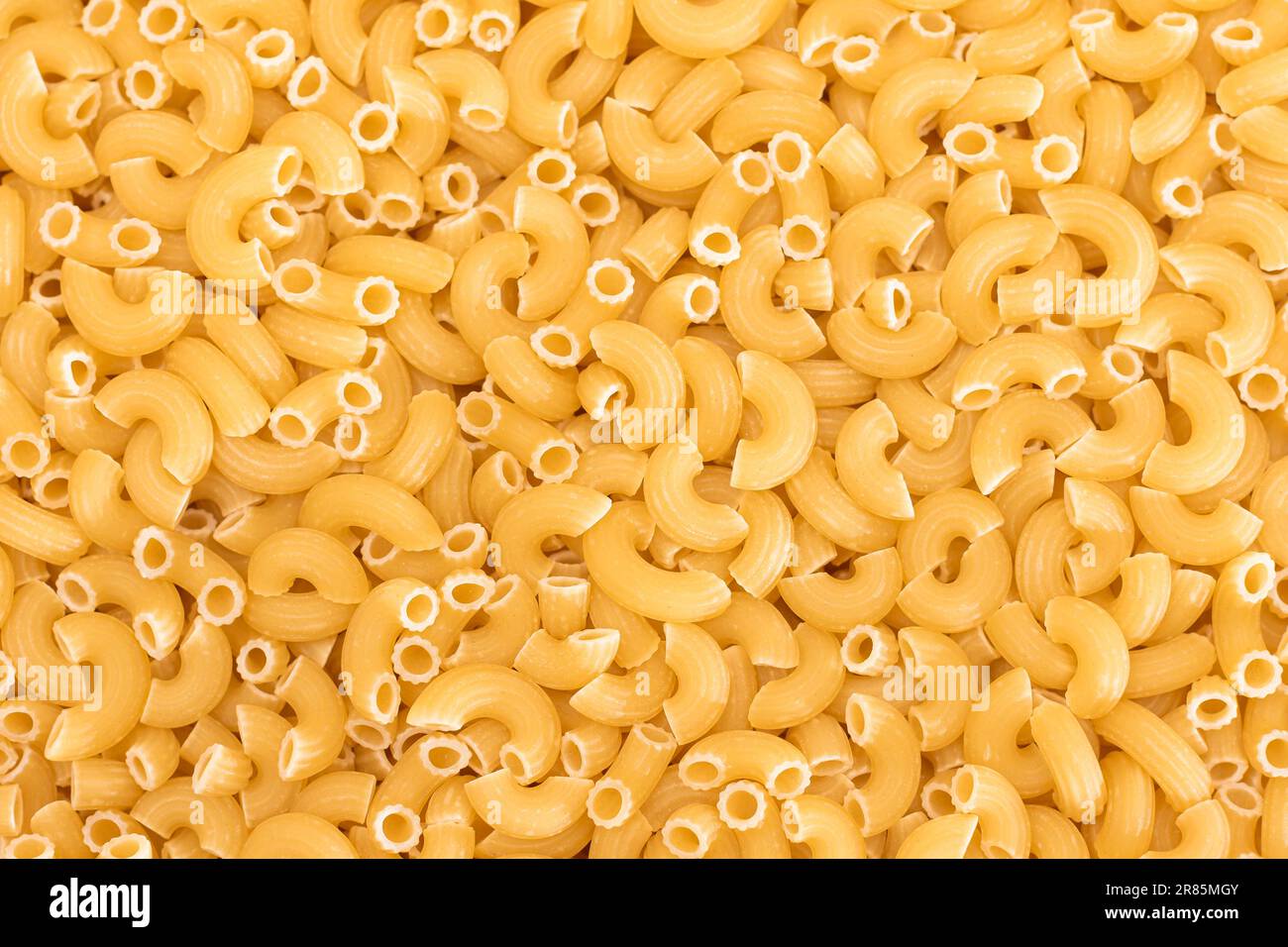 Uncooked Chifferi Rigati Pasta Background. Fat and Unhealthy Food ...
