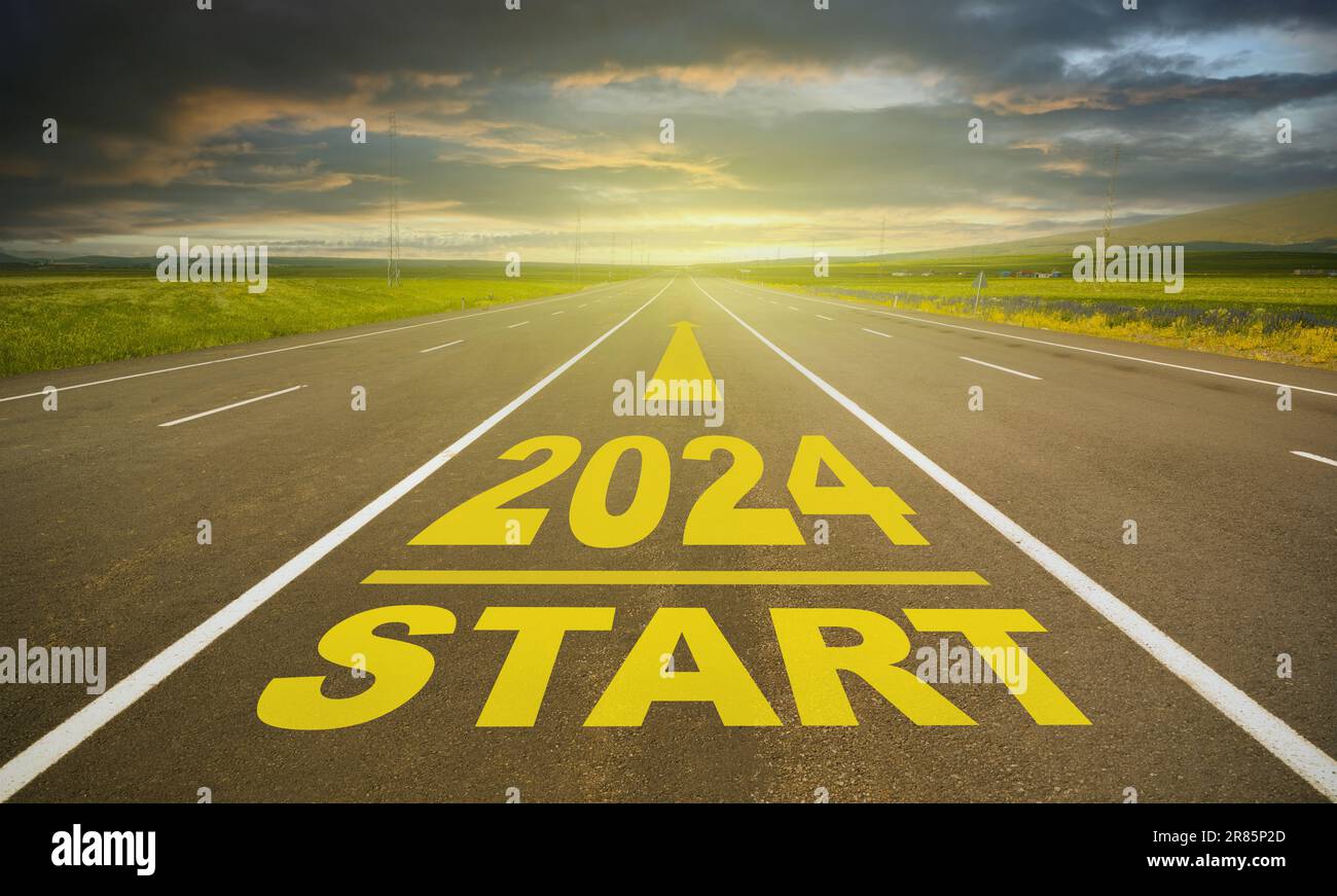 2024 lettering on empty asphalt road. Road in the countryside going